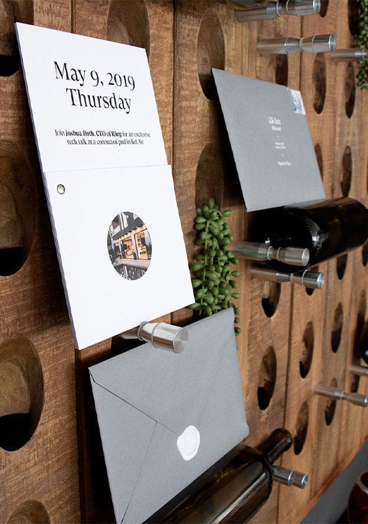 Photograph of Datadog x Ring invitation mounted on the venue's exterior wall.